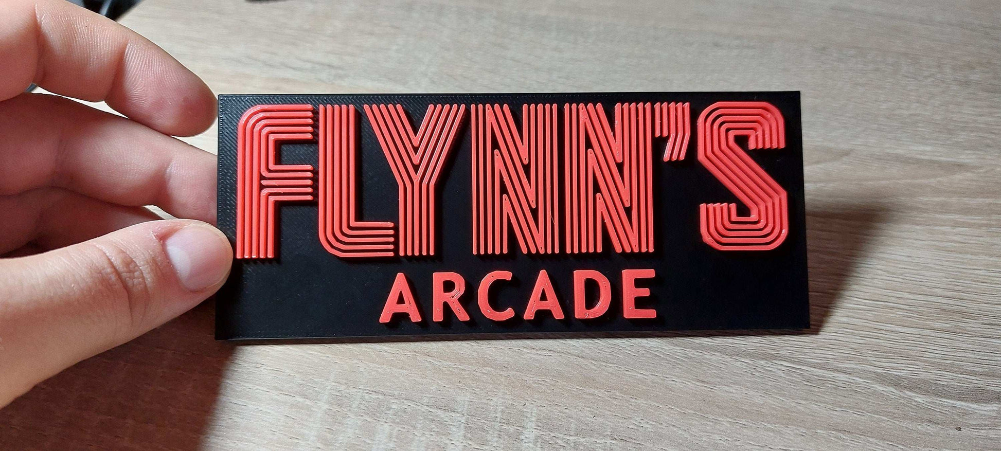 Flynn’s Arcade Tron 1982 Logo Sign – Classic Sci-Fi Movie Collectible for Retro Gaming Fans. - 3DEvricPrinting