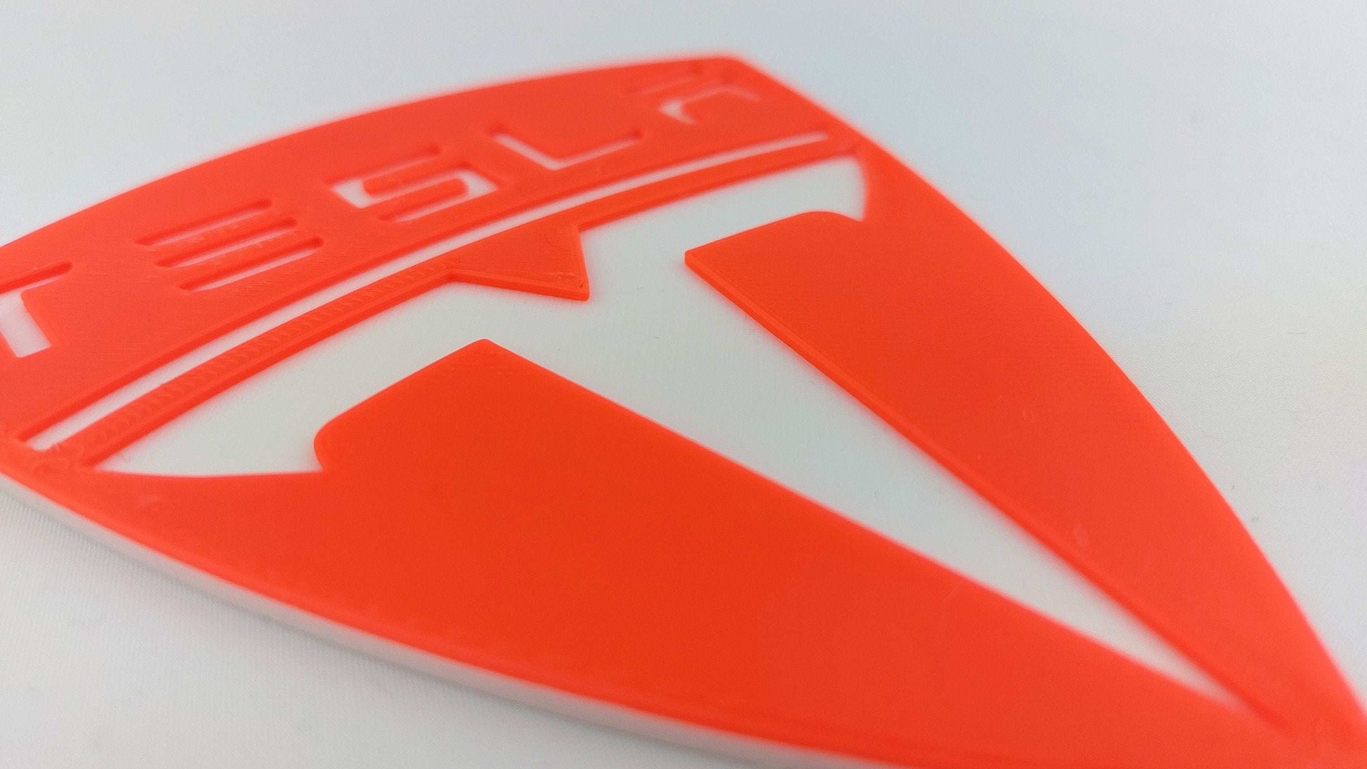 Tesla Logo 3D Printed Sign – Dual Color Red and White Collectible Emblem for Tesla Fans - 3DEvricPrinting