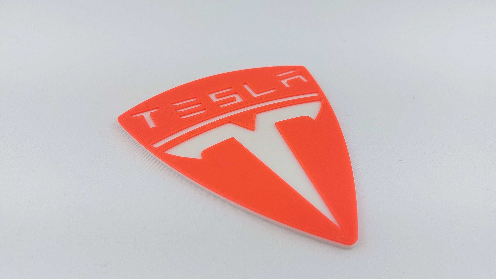 Tesla Logo 3D Printed Sign – Dual Color Red and White Collectible Emblem for Tesla Fans - 3DEvricPrinting
