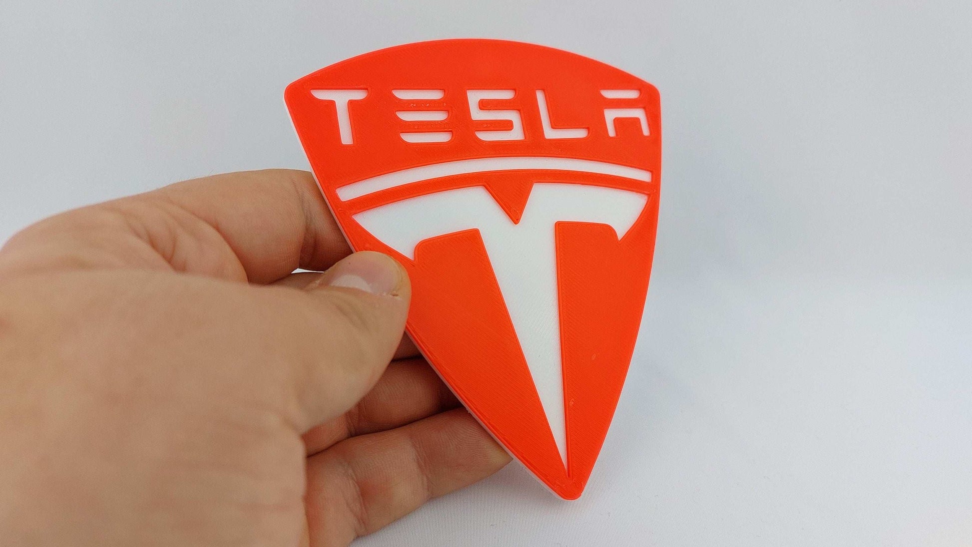 Tesla Logo 3D Printed Sign – Dual Color Red and White Collectible Emblem for Tesla Fans - 3DEvricPrinting